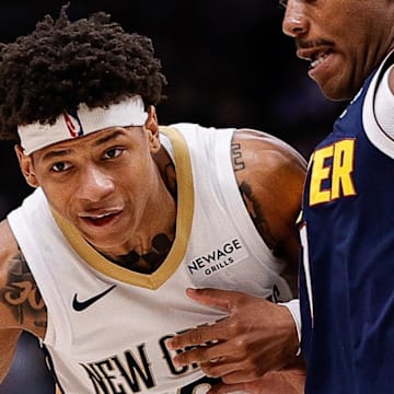 Oct 29, 2025; Denver, Colorado, USA; New Orleans Pelicans guard Jeremiah Fears (0) controls the ball as Denver Nuggets guard Bruce Brown (11) defends in the second quarter at Ball Arena. Mandatory Credit: Isaiah J. Downing-Imagn Images