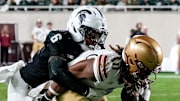 Michigan State's Ade Willie, left, tackles Boston College's Lewis Bond during the second quarter on Saturday, Sept. 6, 2025, at Spartan Stadium in East Lansing.