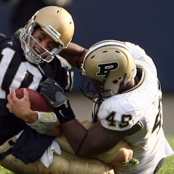 Notre Dame Fighting Irish quarterback Brady Quinn is sacked by Purdue Boilermakers defensive end Eugene Bright 