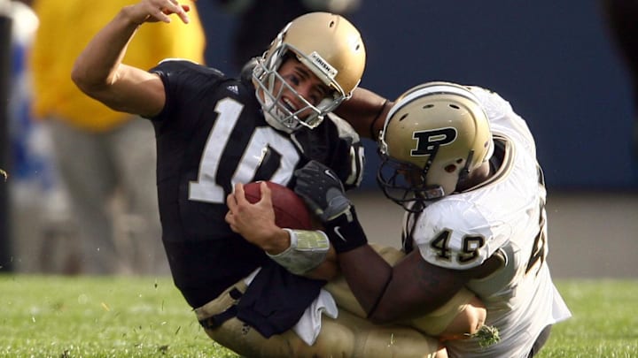 Notre Dame Fighting Irish quarterback Brady Quinn is sacked by Purdue Boilermakers defensive end Eugene Bright 