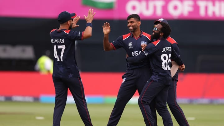 USA cricket team players celebrate the dismissal of India's Virat Kohli in the T20 World Cup. 
