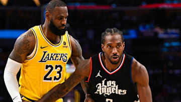 Nov 1, 2023; Los Angeles, California, USA;  LA Clippers forward Kawhi Leonard (2) moves the ball against Los Angeles Lakers forward LeBron James (23) during the second half at Crypto.com Arena. Mandatory Credit: Jonathan Hui-Imagn Images