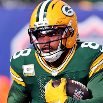 Green Bay Packers running back Josh Jacobs (8) runs the ball against New York Giants defensive tackle Roy Robertson-Harris.