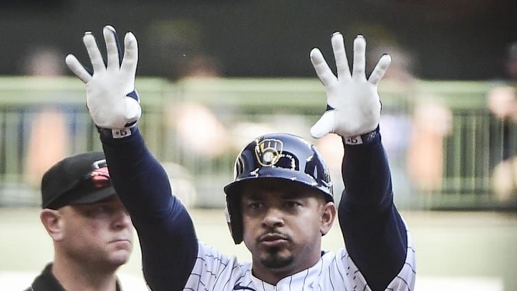 Sep 19, 2021; Milwaukee, Wisconsin, USA; Milwaukee Brewers third baseman Eduardo Escobar (5) reacts