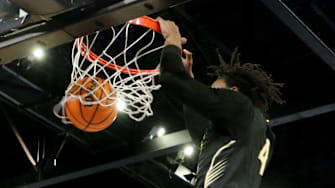 Hale County forward Gage Mayfield (4) dunks the ball against Fultondale at Bill Harris Arena after the Central Region semifinal game Monday.