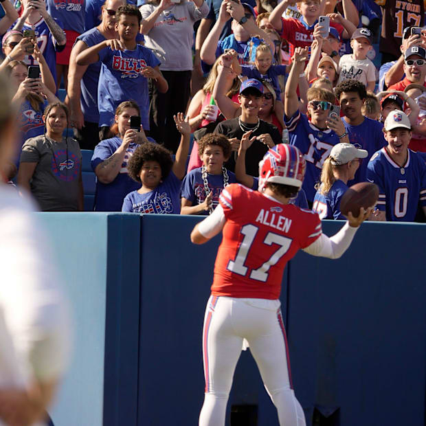 Josh Allen makes his way around the stadium playing catch