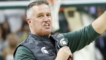 Michigan State Spartans head football coach Pat Fitzgerald points while introducing himself to the crowd at a men's basketball game against the Iowa Hawkeyes on Tuesday, Dec. 2, 2025. Fitzgerald was officially hired by MSU on Monday.