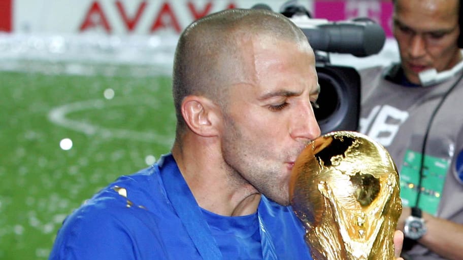 Alessandro Del Piero kisses the World Cup trophy following their 5-3 win over France on penalty kicks.