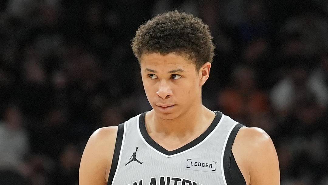 Feb 7, 2026; San Antonio, Texas, USA;  San Antonio Spurs forward Carter Bryant (11) walks up the court in the second half against the Dallas Mavericks at Frost Bank Center. Mandatory Credit: Daniel Dunn-Imagn Images