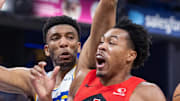 Toronto Raptors forward/guard Scottie Barnes shoots the ball while Indiana Pacers center/forward Tony Bradley defends.