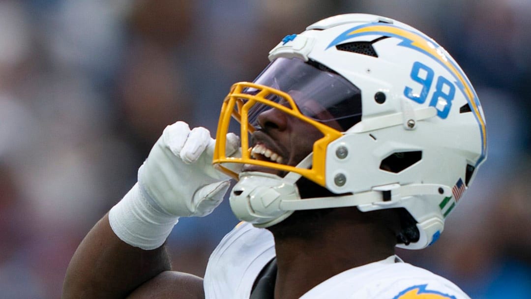 Los Angeles linebacker Odafe Oweh (98) celebrates his Tennessee quarterback Cam Ward (1) sack during the second half of their game at Nissan Stadium in Nashville, Tenn., Sunday, Nov. 2, 2025.