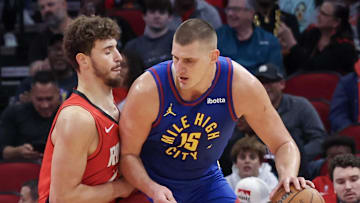 Nov 12, 2023; Houston, Texas, USA; Denver Nuggets center Nikola Jokic (15) dribbles against Houston Rockets center Alperen Sengun (28) in the first quarter  at Toyota Center. Mandatory Credit: Thomas Shea-Imagn Images