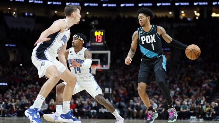 Jan 10, 2023; Portland, Oregon, USA; Portland Trail Blazers shooting guard Anfernee Simons (1) controls the ball as Orlando Magic small forward Franz Wagner (22, left) defends during the first half at Moda Center. 