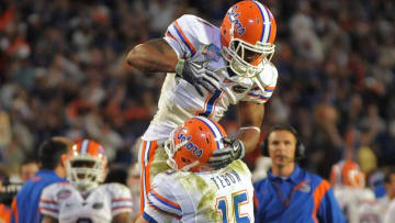 Jan 8, 2009; Miami, FL, USA; Florida Gators quarterback Tim Tebow (15) celebrates a touchdown pass with wide receiver Percy Harvin (1) during the fourth quarter of the 2009 BCS Championship Game against the Oklahoma Sooners at Dolphin Stadium.  Mandatory Credit: James Lang-USA TODAY Sports