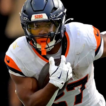 Sep 21, 2025; Inglewood, California, USA;   Denver Broncos running back J.K. Dobbins (27) carries the ball in the second half against the Los Angeles Chargers at SoFi Stadium. Mandatory Credit: Jayne Kamin-Oncea-Imagn Images
