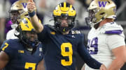 Michigan quarterback J.J. McCarthy points down the field during the second half of the College