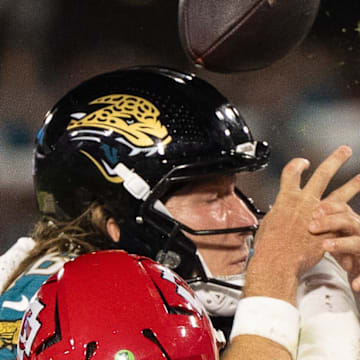 Jacksonville Jaguars quarterback Trevor Lawrence (16) attempts a touchdown in the second quarter but fumbles during a Monday Night NFL football game at EverBank Stadium, Monday, Oct. 6, 2025, in Jacksonville, Fla.