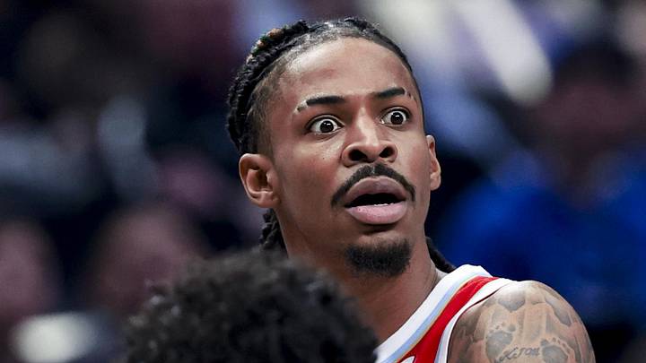 Mar 7, 2025; Dallas, Texas, USA;  Memphis Grizzlies guard Ja Morant (12) reacts as Dallas Mavericks guard Max Christie (00) defends during the first quarter at American Airlines Center. Mandatory Credit: Kevin Jairaj-Imagn Images