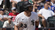 Chicago White Sox left fielder Andrew Benintendi (23) watches his three-run home run sail into the cheap seats against the Chicago Cubs during the eighth inning at Rate Field on Sunday.
