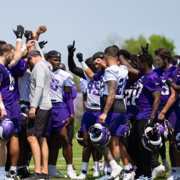 Minnesota Vikings players gather after a rookie minicamp practice. 