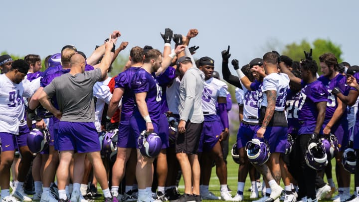 Minnesota Vikings players gather after a rookie minicamp practice. 