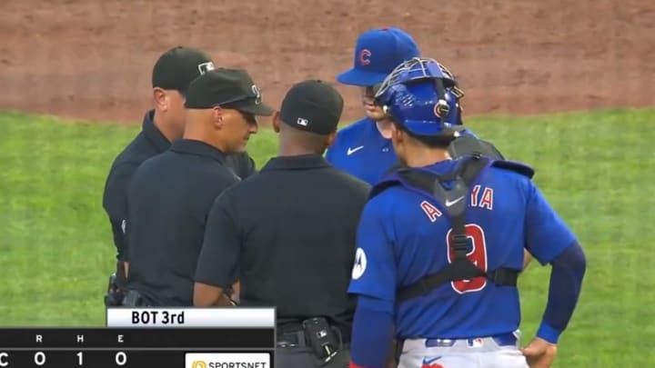 Umpiring crew addresses Justin Steele for "sticky stuff" during a Cubs game against the Pirates