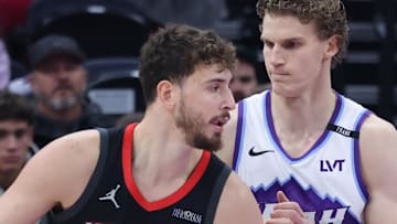 Nov 30, 2025; Salt Lake City, Utah, USA; Houston Rockets center Alperen Sengun (28) posts up against Utah Jazz forward Lauri Markkanen (23) during the first quarter at Delta Center. Mandatory Credit: Rob Gray-Imagn Images