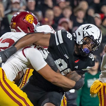 Nebraska defensive lineman Williams Nwaneri rushes USC quarterback Jayden Maiava.