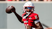 Oct 4, 2025; Raleigh, North Carolina, USA; NC State Wolfpack quarterback CJ Bailey (11) prepares to throw the ball during the first half of the game against Campbell Fighting Camels at Carter-Finley Stadium. Mandatory Credit: Jaylynn Nash-Imagn Images