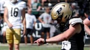 Purdue Boilermakers punter Bennett Boehnlein holds a field goal attempt for place kicker Spencer Porath 