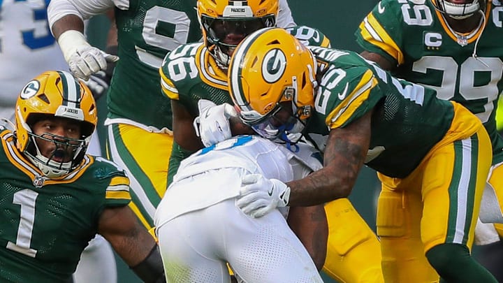 Detroit Lions RB Jahmyr Gibbs (0) is brought down by Green Bay Packers defensive end Micah Parsons (1) Detroit Lions RB Jahmyr Gibbs (0) is brought down by Green Bay Packers defensive end Micah Parsons (1)