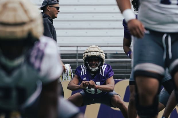 Isaiah Ward stretches out in UW practice. 