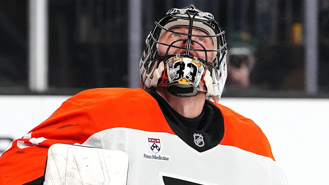 Jan 19, 2026; Las Vegas, Nevada, USA; Philadelphia Flyers goaltender Samuel Ersson (33) watches the puck after deflecting a Vegas Golden Knights shot during the first period at T-Mobile Arena. 