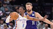 Sacramento Kings forward Domantas Sabonis (11) defends against Oklahoma City Thunder forward Jalen Williams (8) during the second quarter at Golden 1 Center.