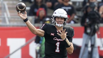 Houston Cougars quarterback Conner Weigman passes against the West Virginia Mountaineers  in the first half at TDECU Stadium.