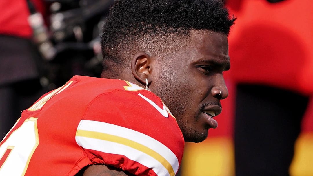 Former Kansas City Chiefs wide receiver Tyreek Hill (10) watches warm-ups before the AFC Championship Game against the Cincinnati Bengals at GEHA Field at Arrowhead Stadium.
