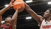 Kevin Thomas (right) blocks a shot, for Sagemont Prep, during the 2025 FHSAA Class 1A boys basketball state championship game at the RP Funding Center in February.