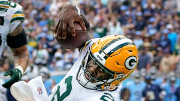 Green Bay Packers quarterback Malik Willis (2) scores a touchdown past Tennessee Titans cornerback Roger McCreary (21) during the first quarter at Nissan Stadium in Nashville, Tenn., Sunday, Sept. 22, 2024.