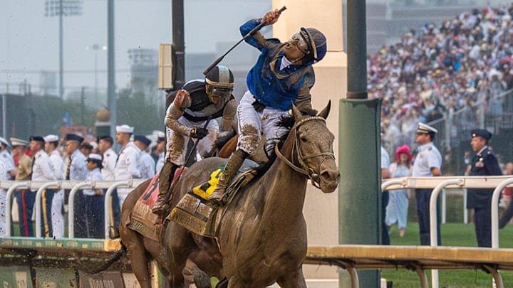 Jockey Junior Alvarado celebrates after riding Sovereignty to victory in the 151st Kentucky Derby at Churchill Downs in Louisville, Kentucky.