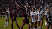 Arkansas players celebrate a goal during the Razorbacks' 4-2 win against Mississippi State.