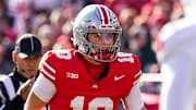 Ohio State Buckeyes quarterback Julian Sayin (10) yells at his teammates in the first half of the NCAA football game at Ohio Stadium on Saturday, Nov. 22, 2025 in Columbus, Ohio.