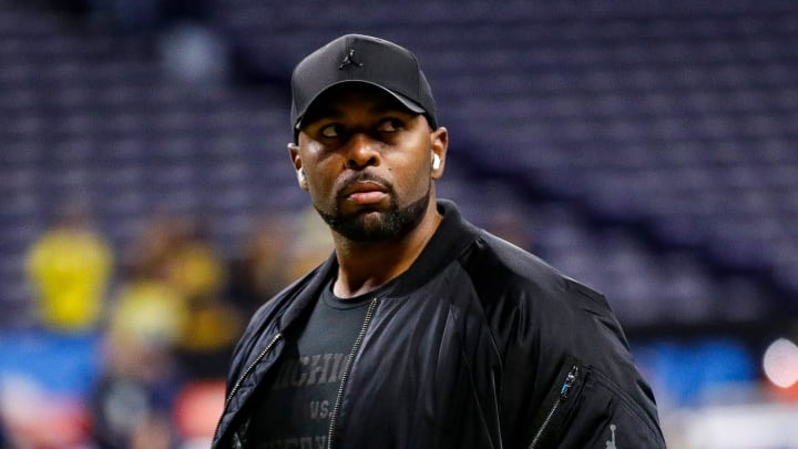 Michigan offensive coordinator Sherrone Moore watches warm up before the Big Ten championship game at Lucas Oil Stadium in Indianapolis on Saturday, Dec. 2, 2023.