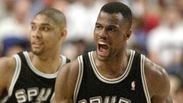 David Robinson (R) celebrates a basket with Tim Du