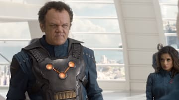 Marvel's Guardians Of The Galaxy..L to R: Corpsman Dey (John C. Reilly) and Nova Prime's Assistant (Mikaela Hoover)..Ph: Film Frame..©Marvel 2014