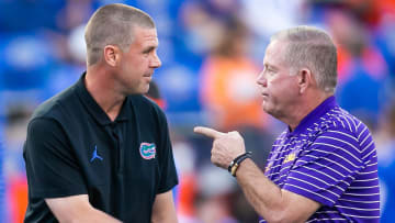Florida Gators head coach Billy Napier, left and LSU Tigers head coach Brian Kelly talk at Steve Spurrier Field at Ben Hill Griffin Stadium in Gainesville, FL on Saturday, October 15, 2022 before the start of the game. [Doug Engle/Gainesville Sun]