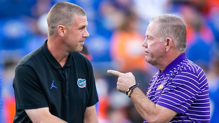 Florida Gators head coach Billy Napier, left and LSU Tigers head coach Brian Kelly talk at Steve Spurrier Field at Ben Hill Griffin Stadium in Gainesville, FL on Saturday, October 15, 2022 before the start of the game. [Doug Engle/Gainesville Sun]