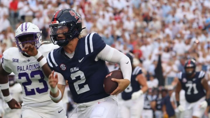 Ole Miss Rebels quarterback Jaxson Dart runs to the end zone in Saturday's game against the Furman Paladins.