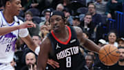 Nov 30, 2025; Salt Lake City, Utah, USA; Houston Rockets forward Jae'Sean Tate (8) moves the ball against Utah Jazz guard Ace Bailey (19) during the second half at Delta Center. Mandatory Credit: Rob Gray-Imagn Images