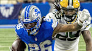Detroit Lions running back Jahmyr Gibbs (26) runs with the ball against the Packers last season.