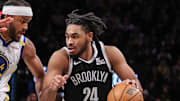 Mar 6, 2025; Brooklyn, New York, USA;  Brooklyn Nets guard Cam Thomas (24) drives past Golden State Warriors guard Moses Moody (4) in the third quarter at Barclays Center. Mandatory Credit: Wendell Cruz-Imagn Images
